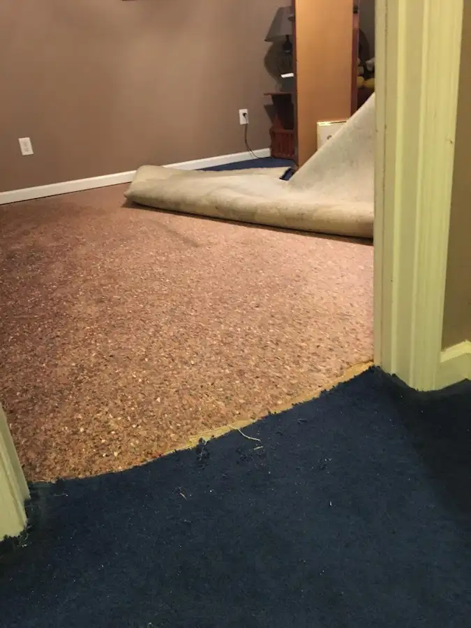 Carpet pad removal revealing water damage during Water Mitigation Services in Ahuimanu